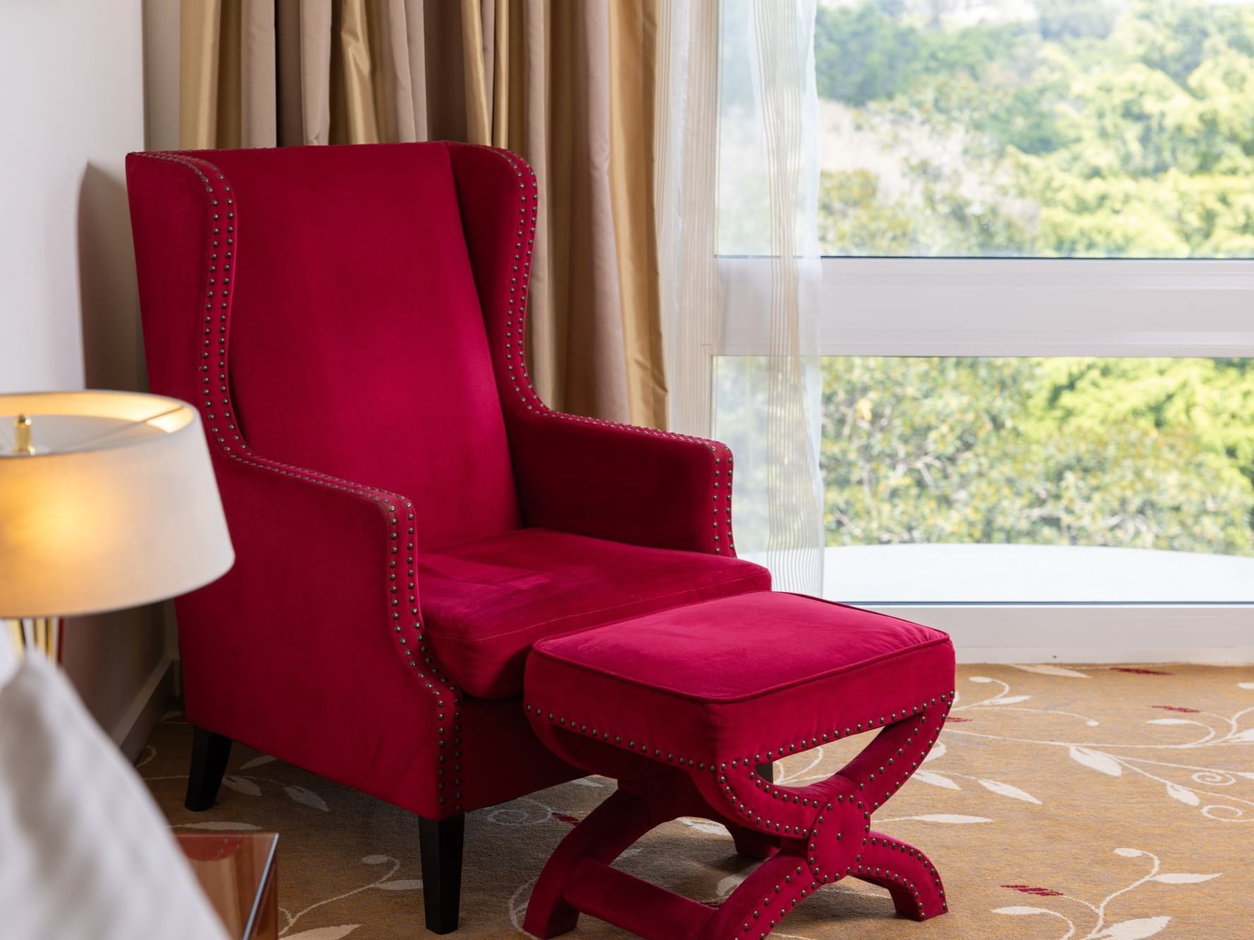 Premium Park View King room with red chair at Royal on the Park