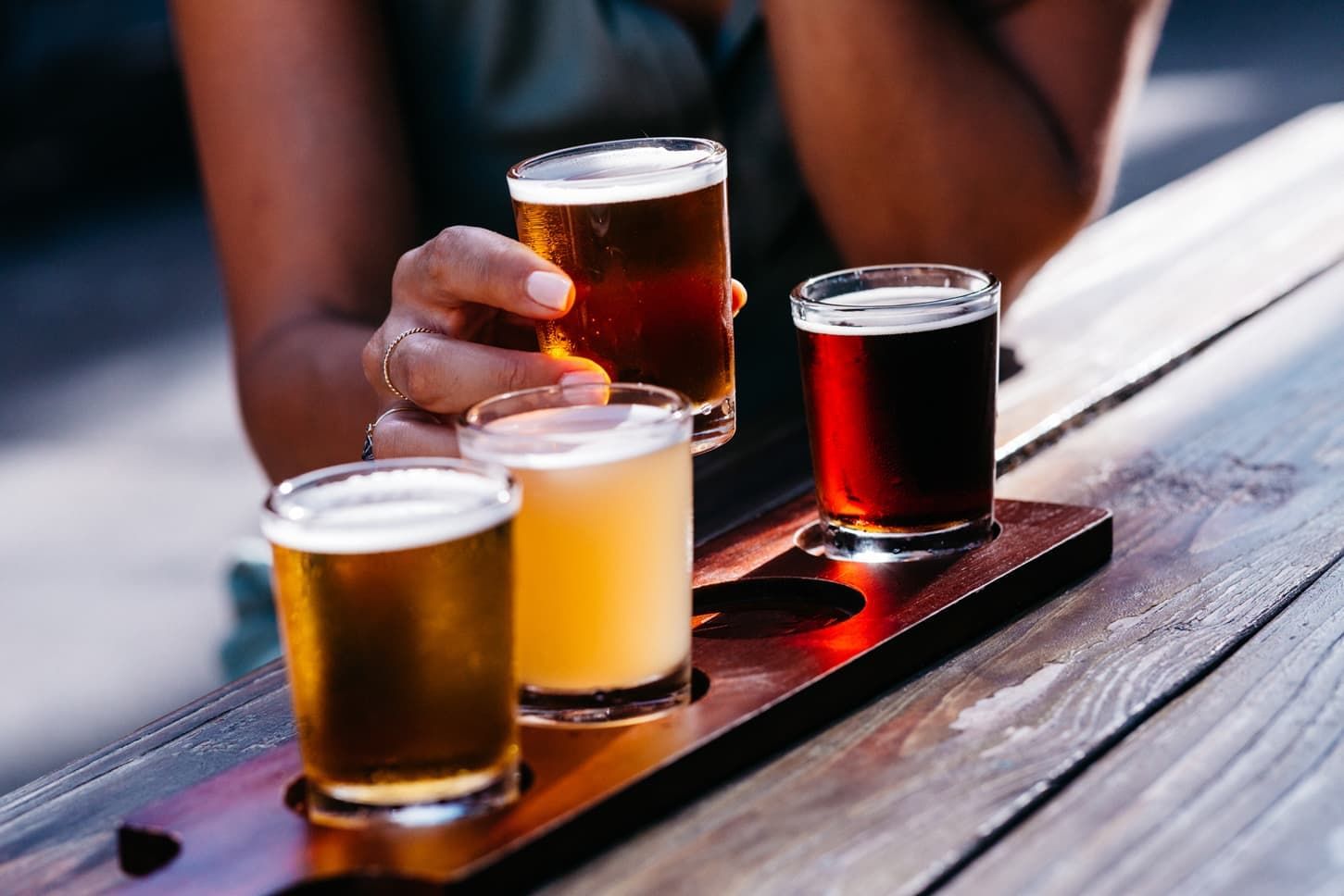 Beer glasses served on a wooden table in Kaka'ako near Waikiki Resort Hotel