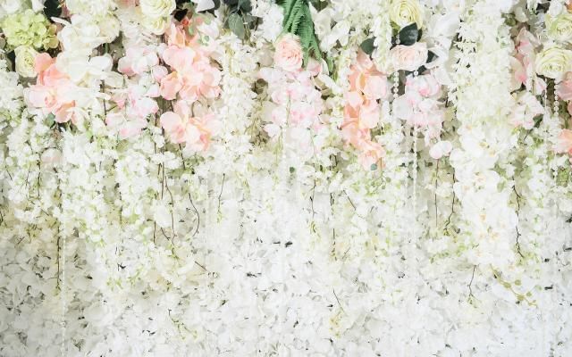 Flower wall at a summer wedding