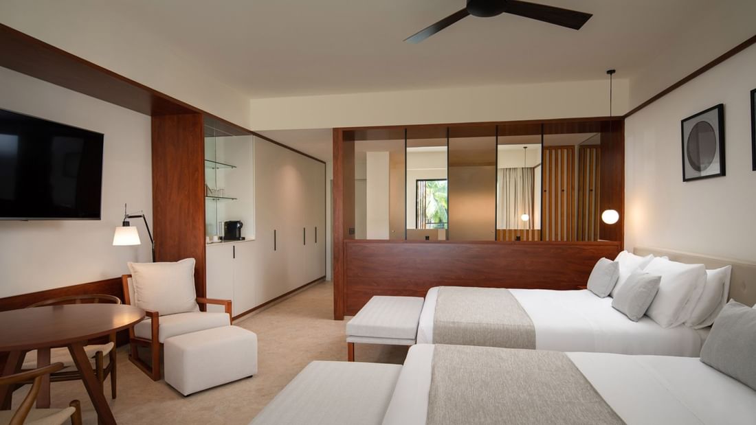 2 Double beds, Chair in Premium pool view room at Live Aqua