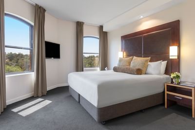 Bed & TV in Riverview Spa Suite at Amora Hotel Melbourne