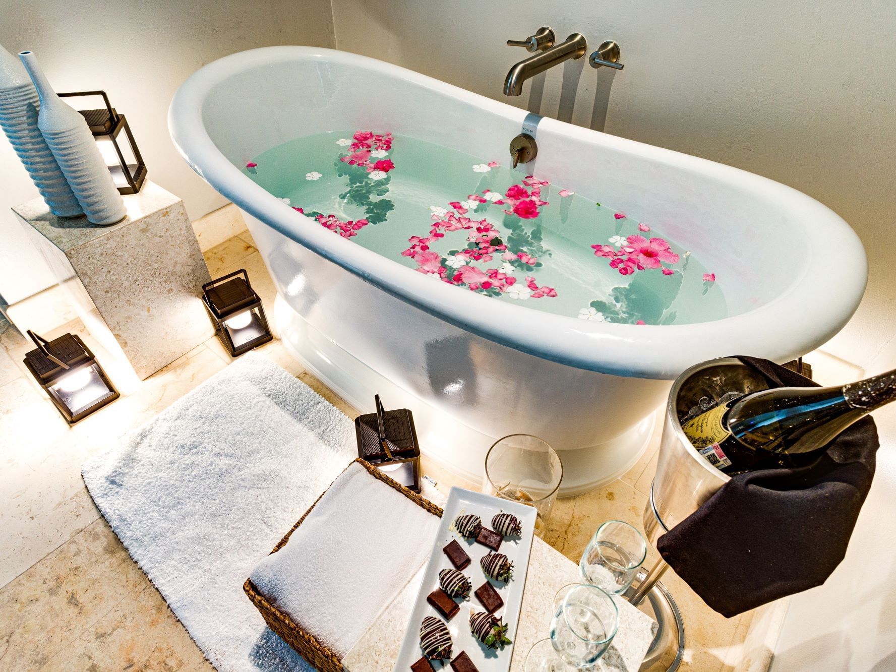Champagne and chocolates served by the bathtub at Alaia Belize Autograph Collection