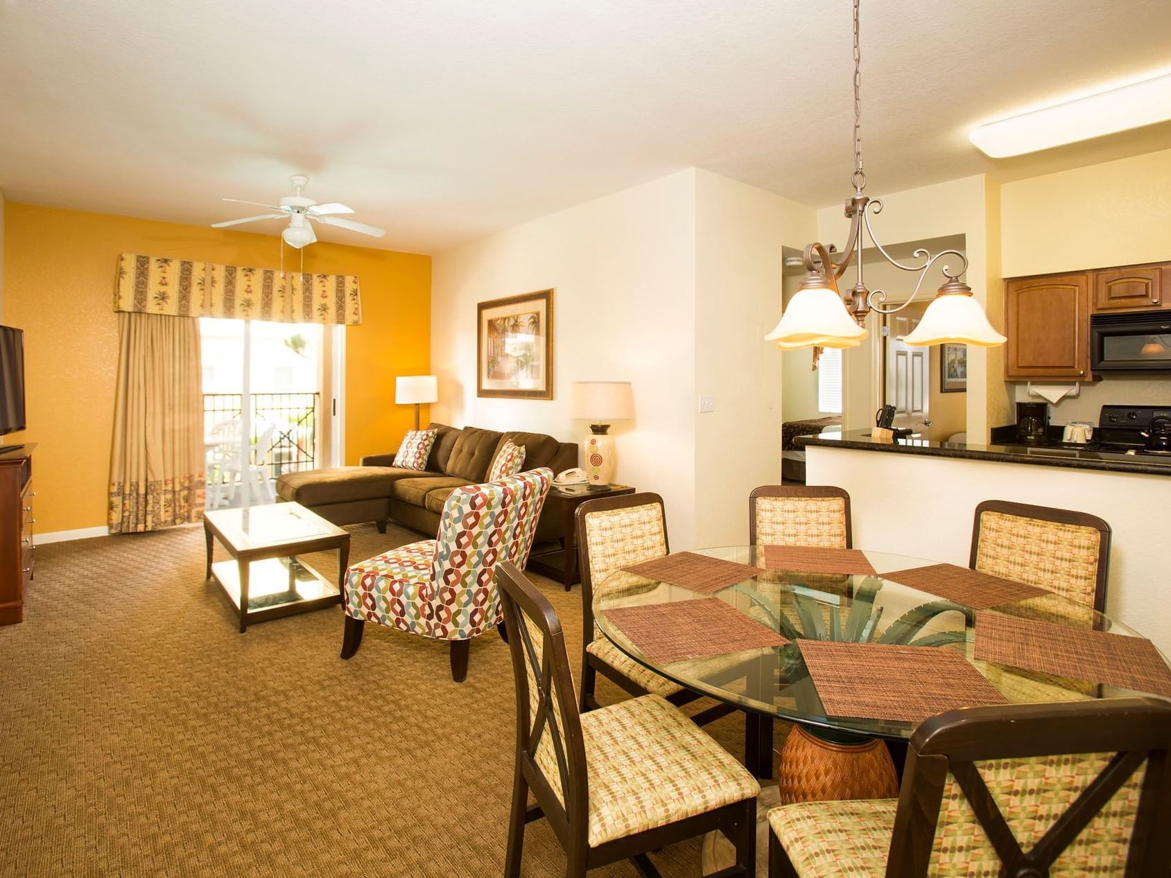 Living area with dining table in 2-Bedroom 2-Bath Resort View Suite at Lake Buena Vista Resort Village & Spa