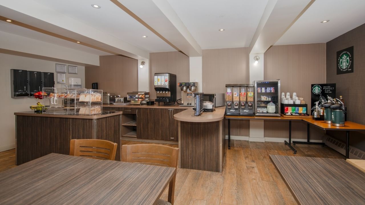 A breakfast room with coffee and pastries