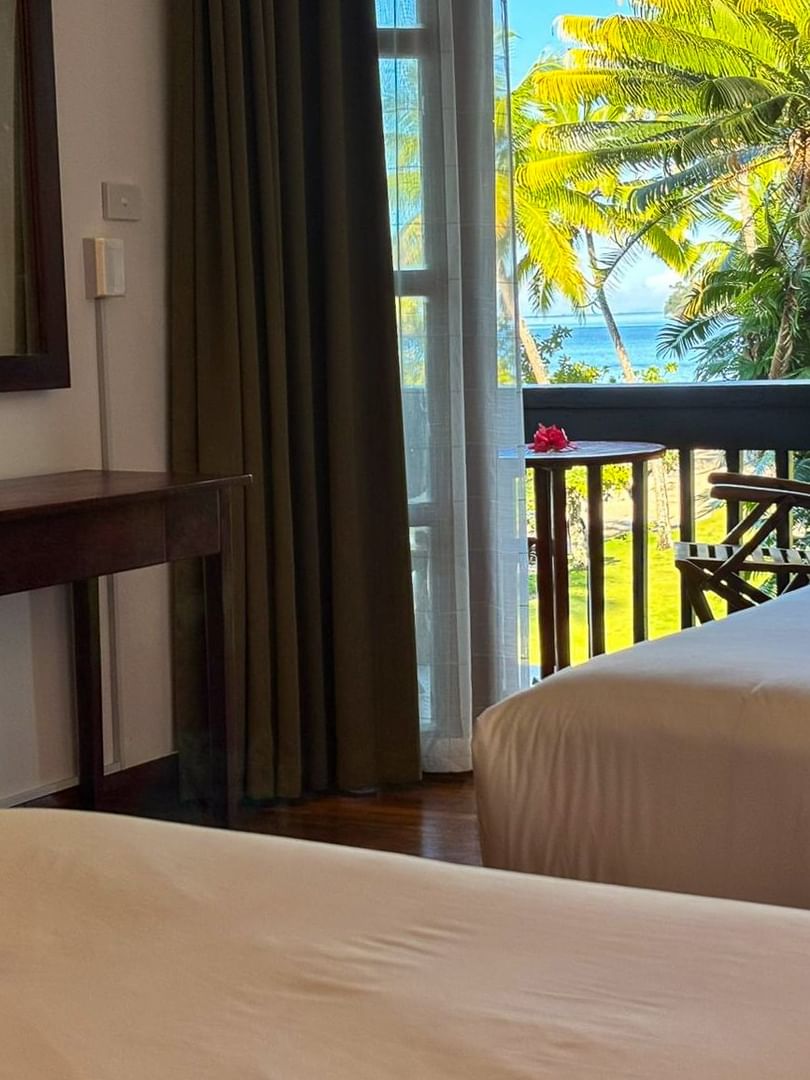 Two beds with ocean view balcony at Warwick Fiji Korolevu.