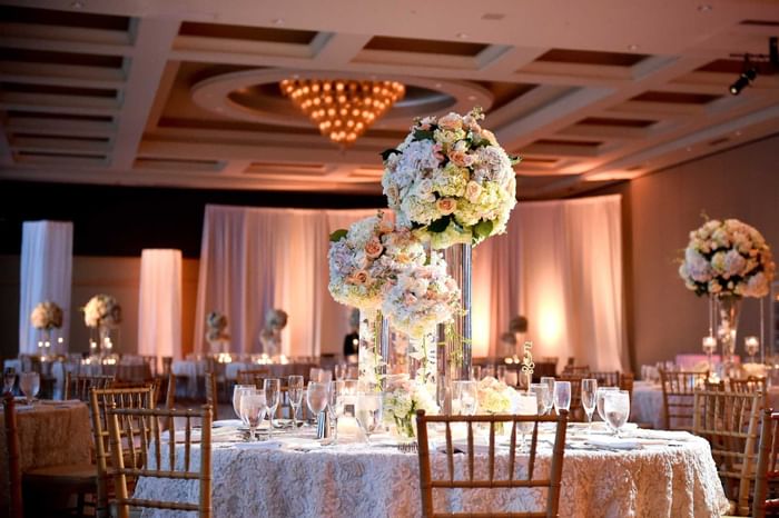 Tables with floral design in a ballroom at Diplomat Beach