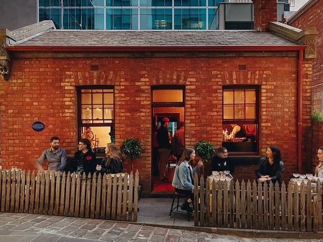 People dining in outdoor of Little Lon Distilling Co at Brady Hotels Jones Lane