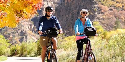 Man and woman biking