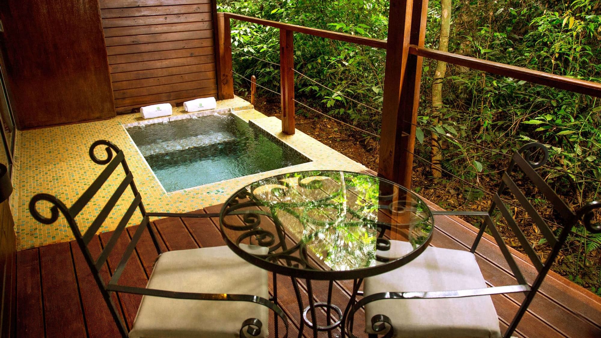 Jacuzzi & lounge with a forest view in Vila Room at DOT Hotels