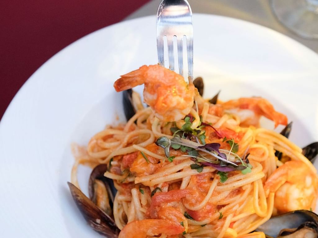 Close-up of a seafood pasta plate served at South Beach Hotel