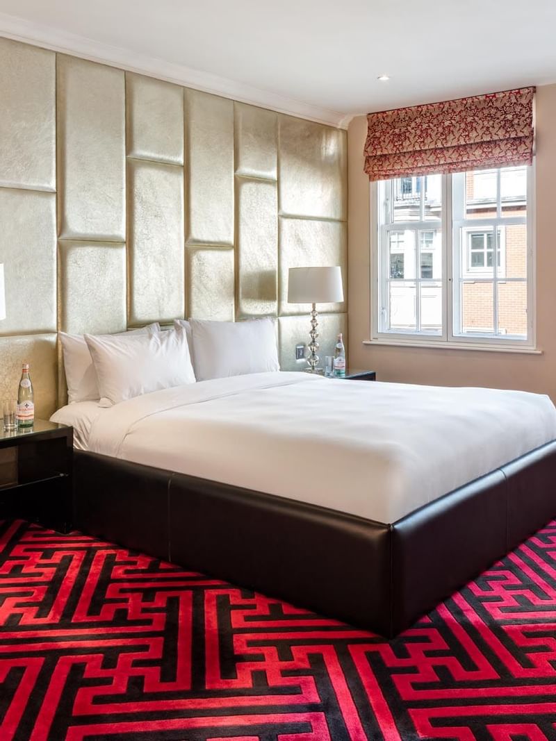 Interior of a room with king bed at The May Fair Hotel London