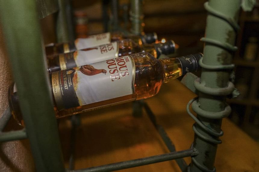 Close-up of whiskey bottles on a rack in a bar at Liebes Rot