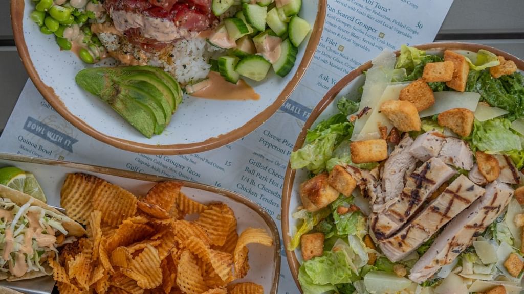 Chips and meat served with vegetables on plates in 30 86 at Camp Creek Inn
