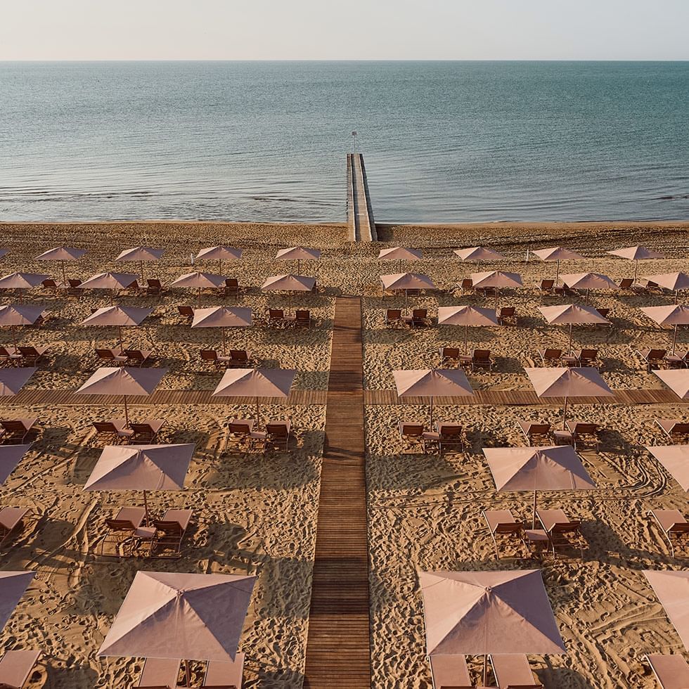 Private beach beds & huts in the beach at Falkensteiner Hotels