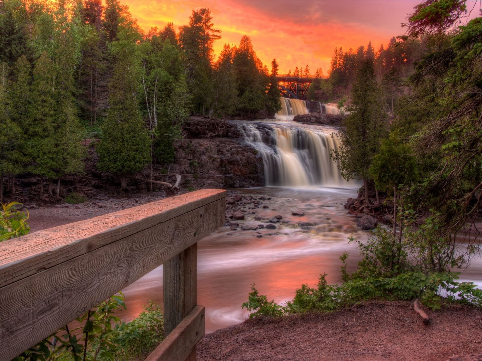 Waterfall in the woods with a sunset near Lutsen Resort