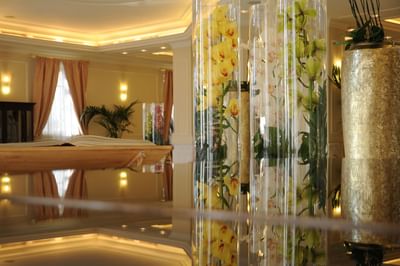 Lobby area with floral decorations & warm lights at Grand Visconti Palace
