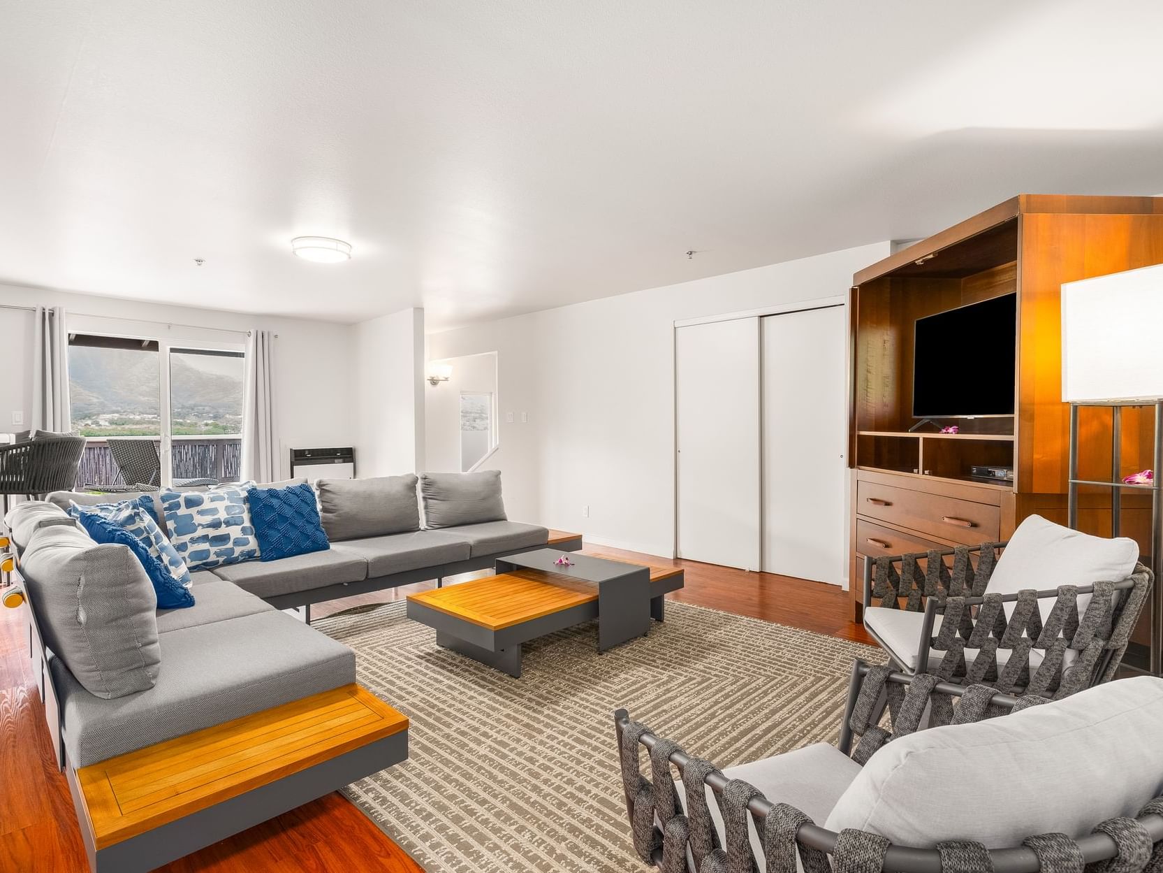 Livingroom area with a picture view in Two-Bedroom Suite at Paradise Bay Resort