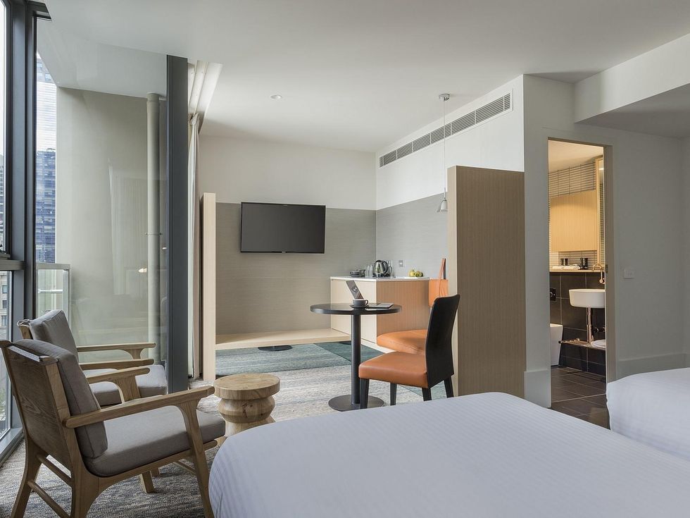 Bed & loungers in Twin Room at Brady Hotels Central Melbourne