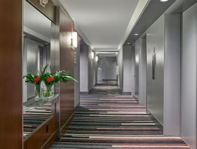 Hallway of the elevator with a door at Matrix Hotel