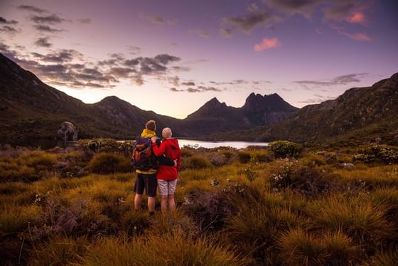 Couple watching at Dove Lake at Cradle Mountain Hotel