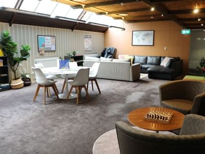 Comfortable living room with sofas, table, and chess board at La Trobe University - Chisholm College.
