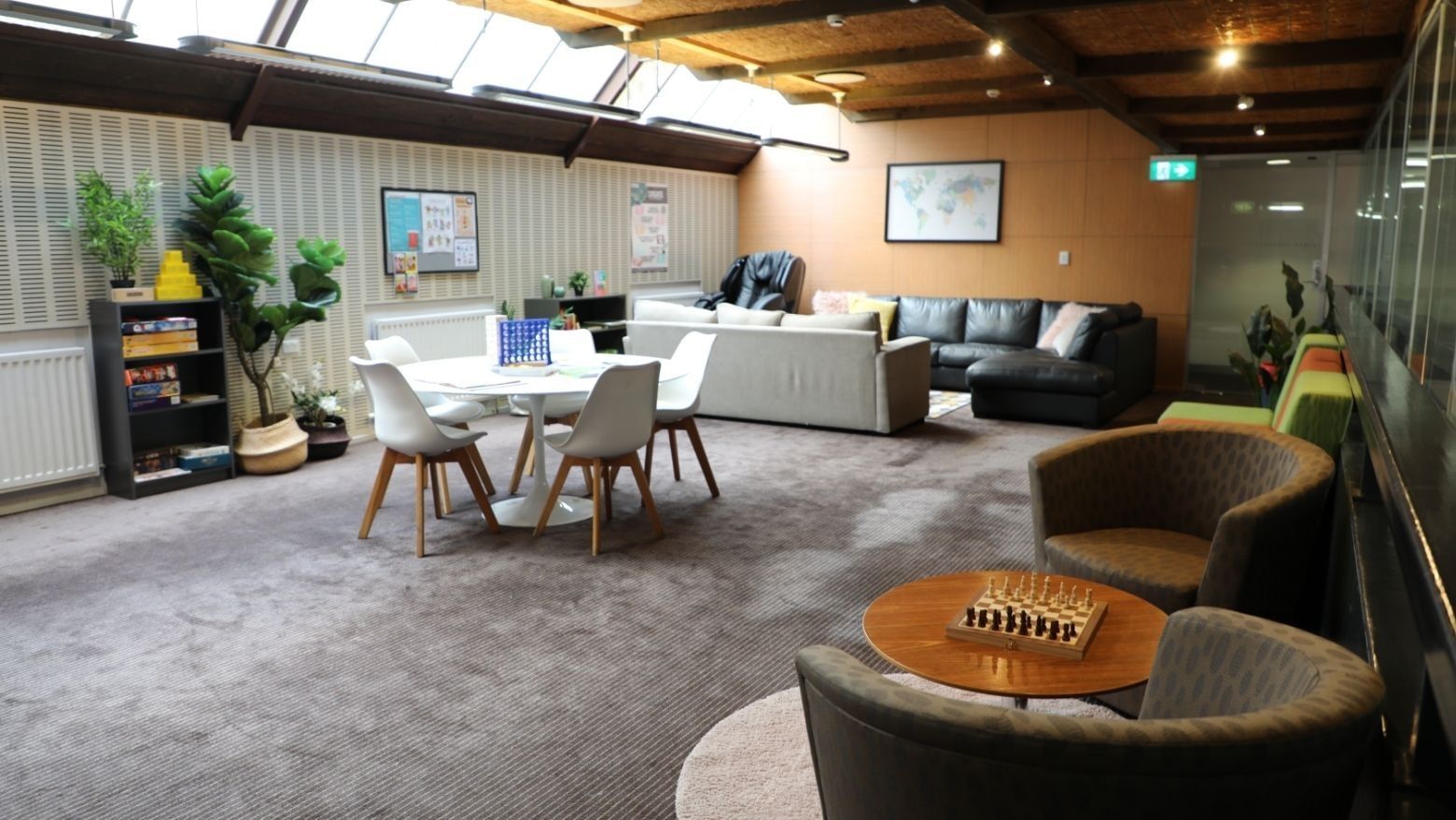 Comfortable living room with sofas, table, and chess board at La Trobe University - Chisholm College.