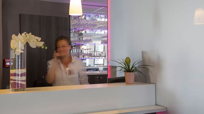 Receptionist at the reception of Hotel Novella Confort Nantes