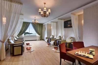 Professional spa therapists providing rejuvenating treatments to couple at LexSpa - Lexis Suites Penang