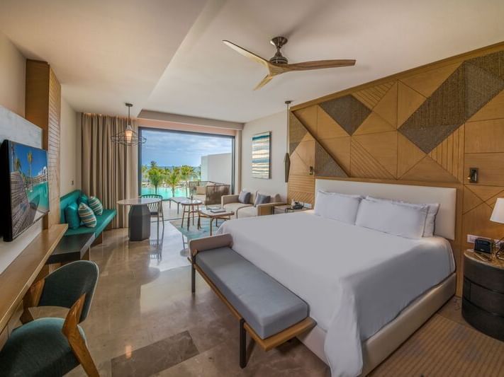 King bed, TV & sofas of Junior Suite Ocean Front View at Heaven Resort