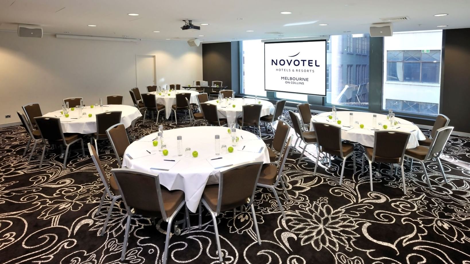 Banquet tables setup for meeting at Novotel Melbourne on Collin