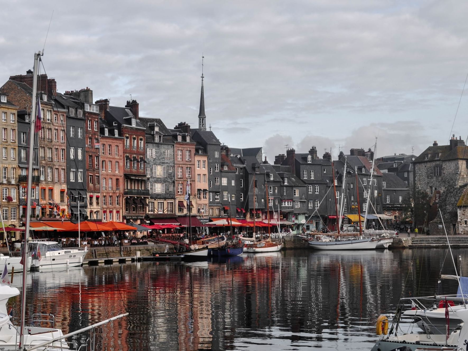 Fishing boats by Port of Honfleur near The Originals Hotels