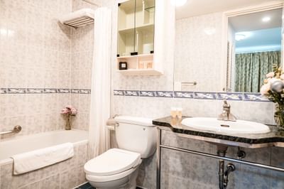 Bathroom vanity with a bathtub at Hanoi Daewoo Hotel