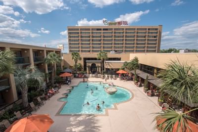 Exterior view of the facade & pool at MCM Elegante Beaumont