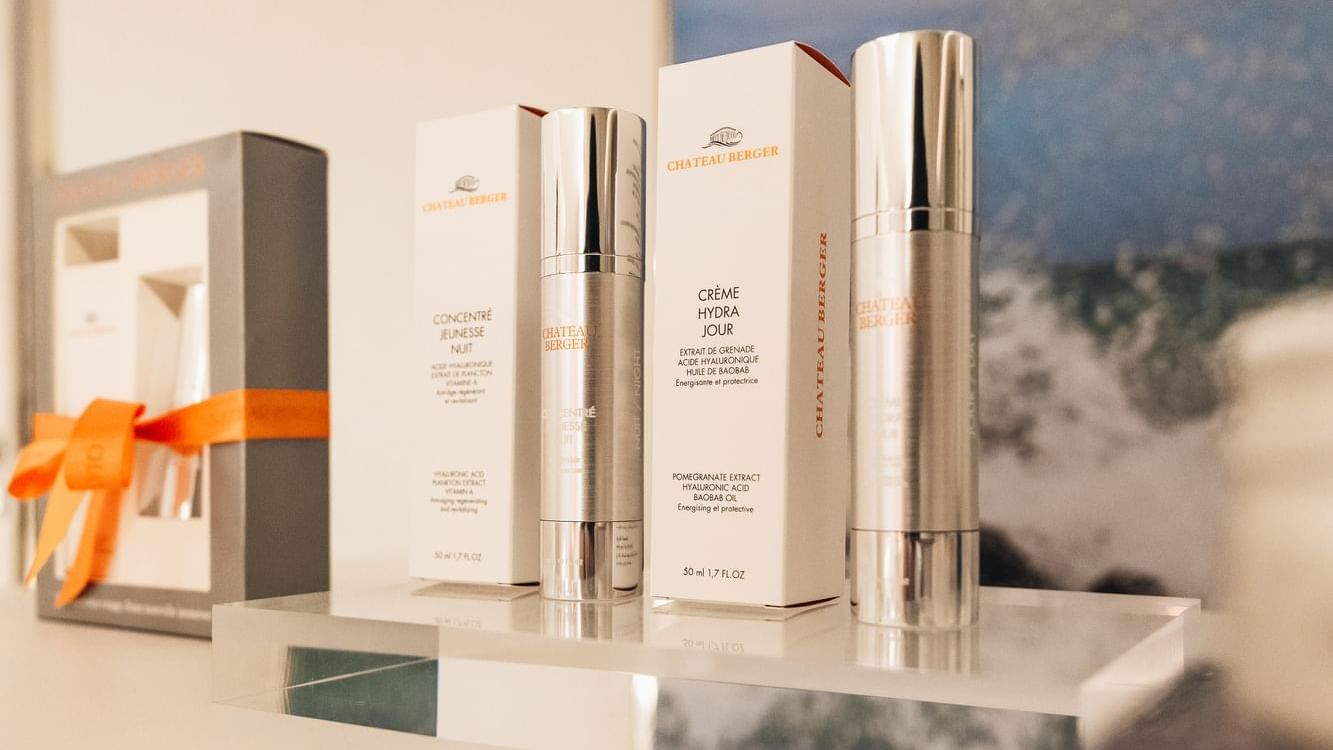Two Château Berger skincare products displayed on a clear shelf in Pause Spa at Paramount Hotel Dubai