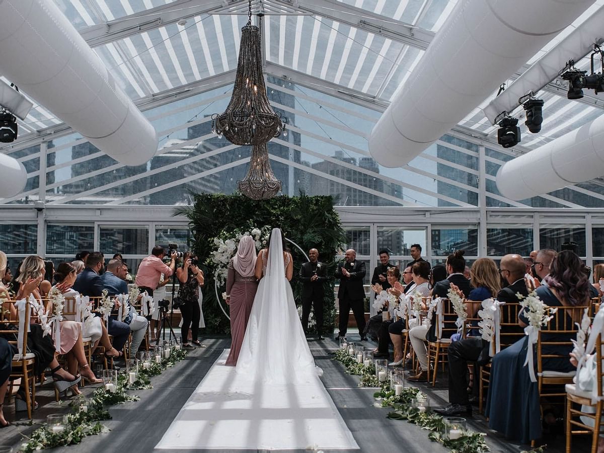 Bride walking down a aisle, wedding ceremony at Crown Hotels