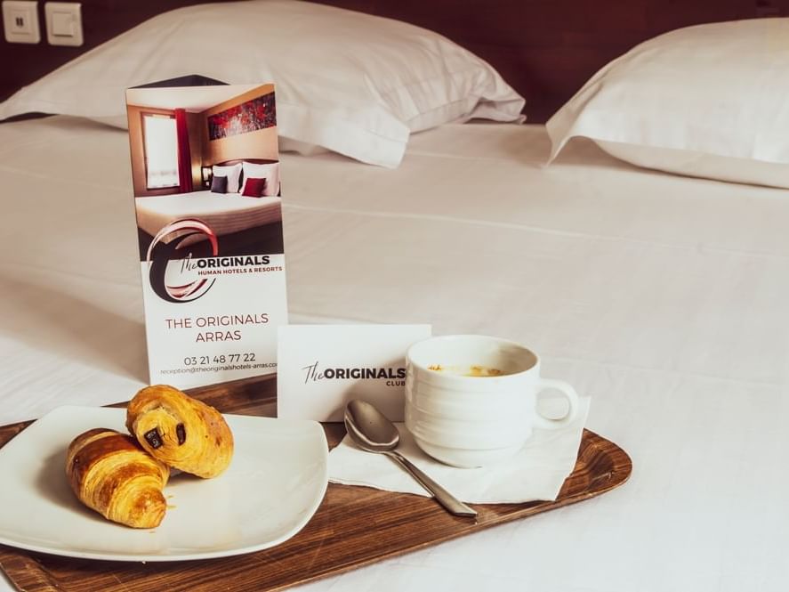 Breakfast severed on bed at Hotel Arras