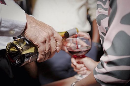 Close up of Pouring wine in a function at Terra Nova Suite