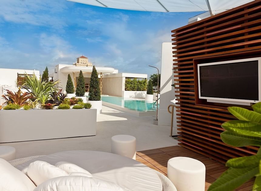 Roof top cabana sunbed pool & lounge at Dream South Beach 