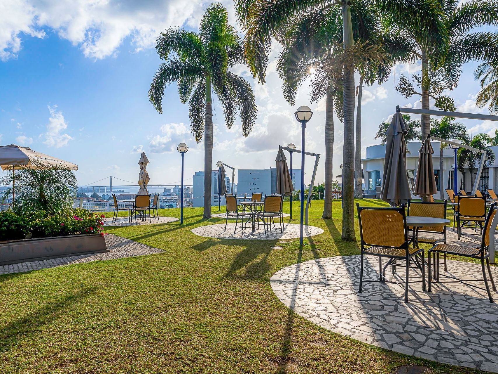 Outdoor lounge area with a sea view at Cardoso Hotel