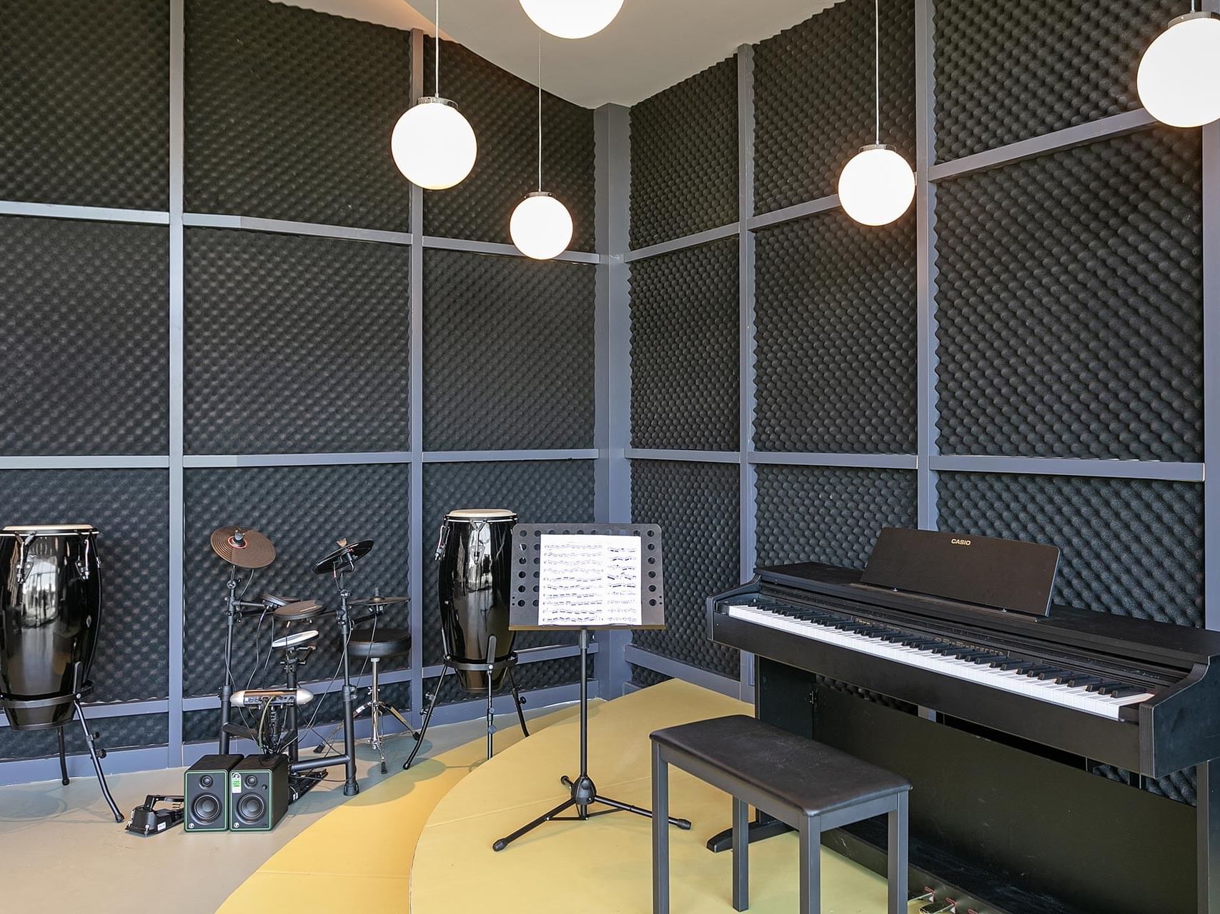 Piano, drum set, and percussions well arranged in Kikoa Kids Club at Titanic Deluxe Lara