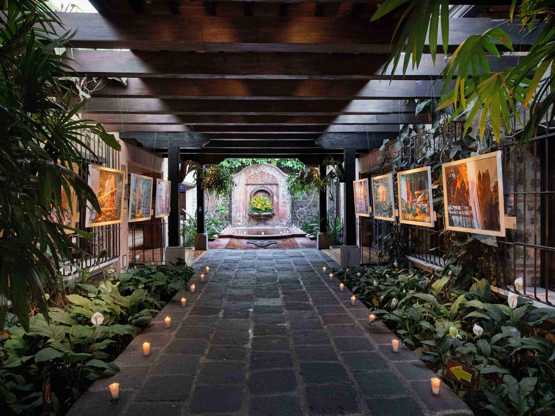 Pictures and candles line at the main entrance of Porta Hotel Antigua.