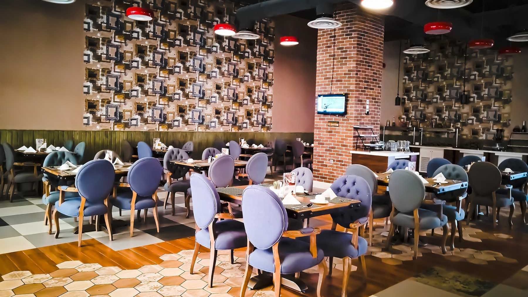 Dining area in Dooh Restaurant and Cafe at Makeen Homes by Warwick - Riyadh