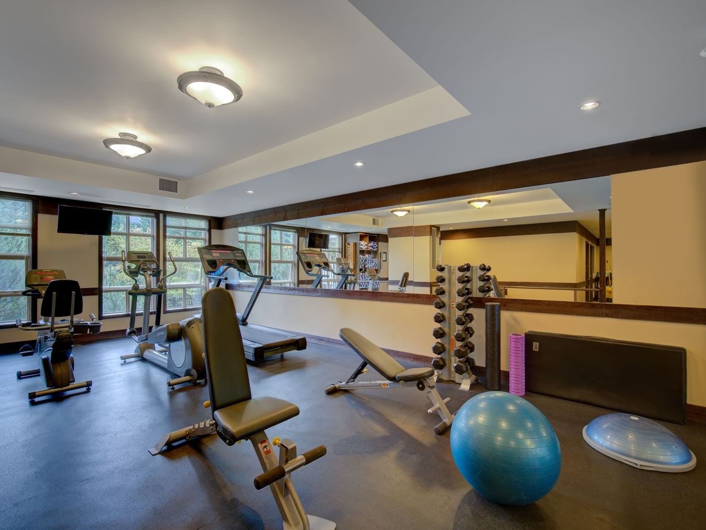 Interior view of fully equipped Fitness Centre at Blackcomb Springs Suites
