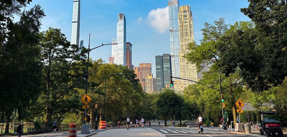 View of Central Park South skyscrapers from a paved walking path near Warwick New York