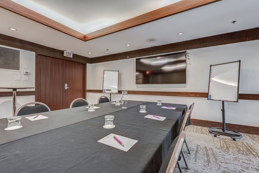 Conference set-up with TV in a Meeting Room at Blackcomb Springs Suites