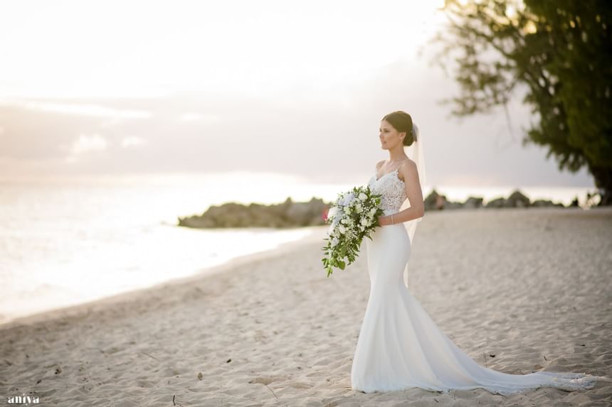 A bride posing on the beach near Southern Palms Beach Club