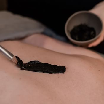 Close-up of a lady having a body treatment in The Spa at Alderbrook Resort & Spa
