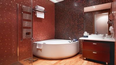 Bathroom with tub in King Executive Suite at Ana Hotels Sport