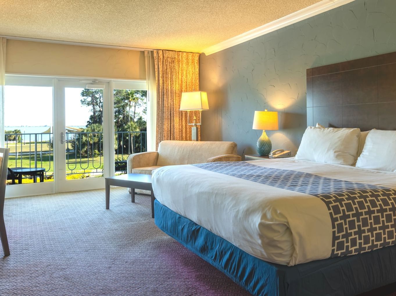 1 King Bed room with balcony and bay view at Safety Harbor Resort & Spa in Tampa Bay, FL.