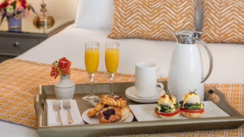 Breakfast in bed in Deluxe Suite at Warwick Melrose Dallas